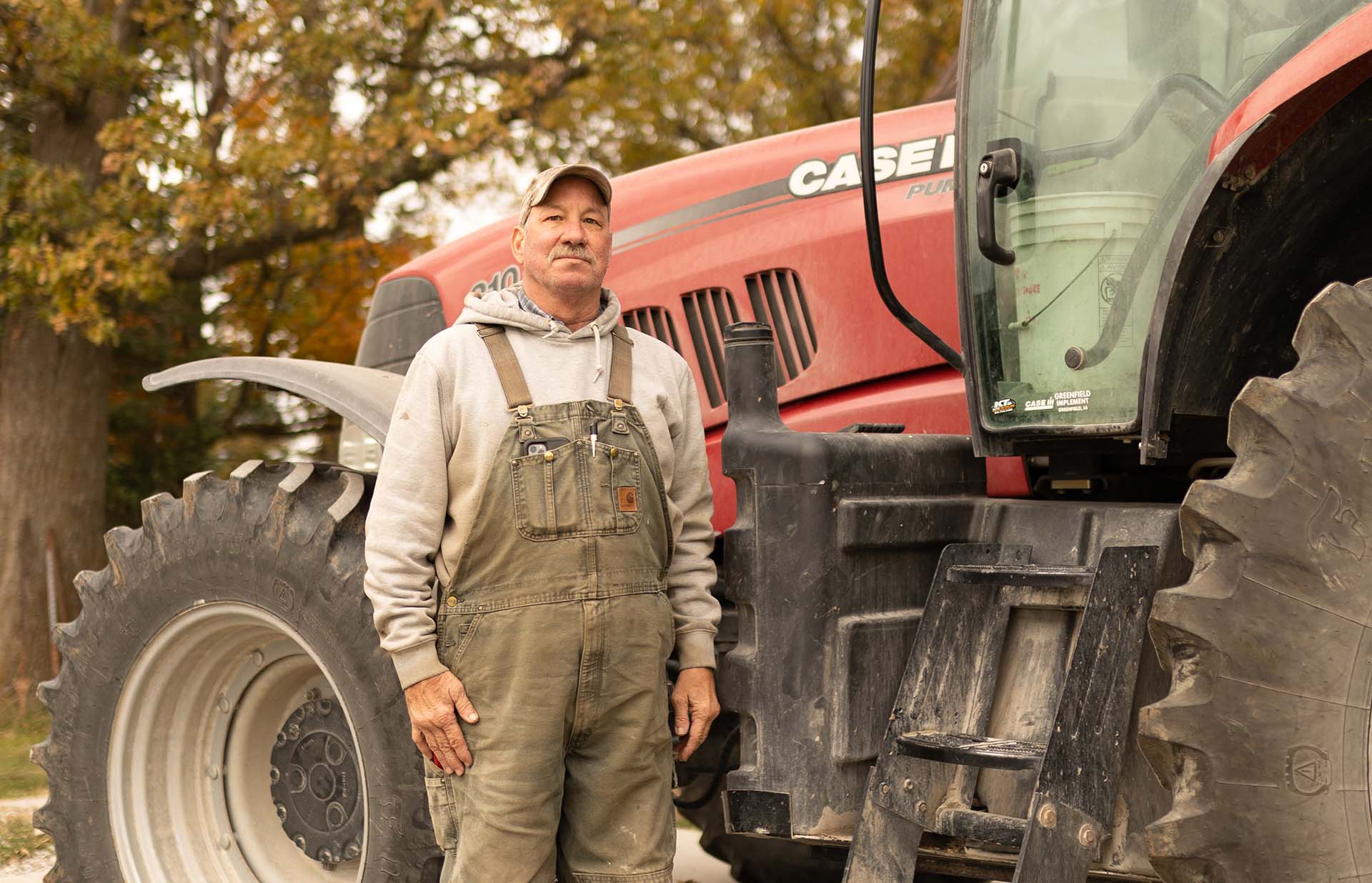 Farmer standing next to Case IH tractor
