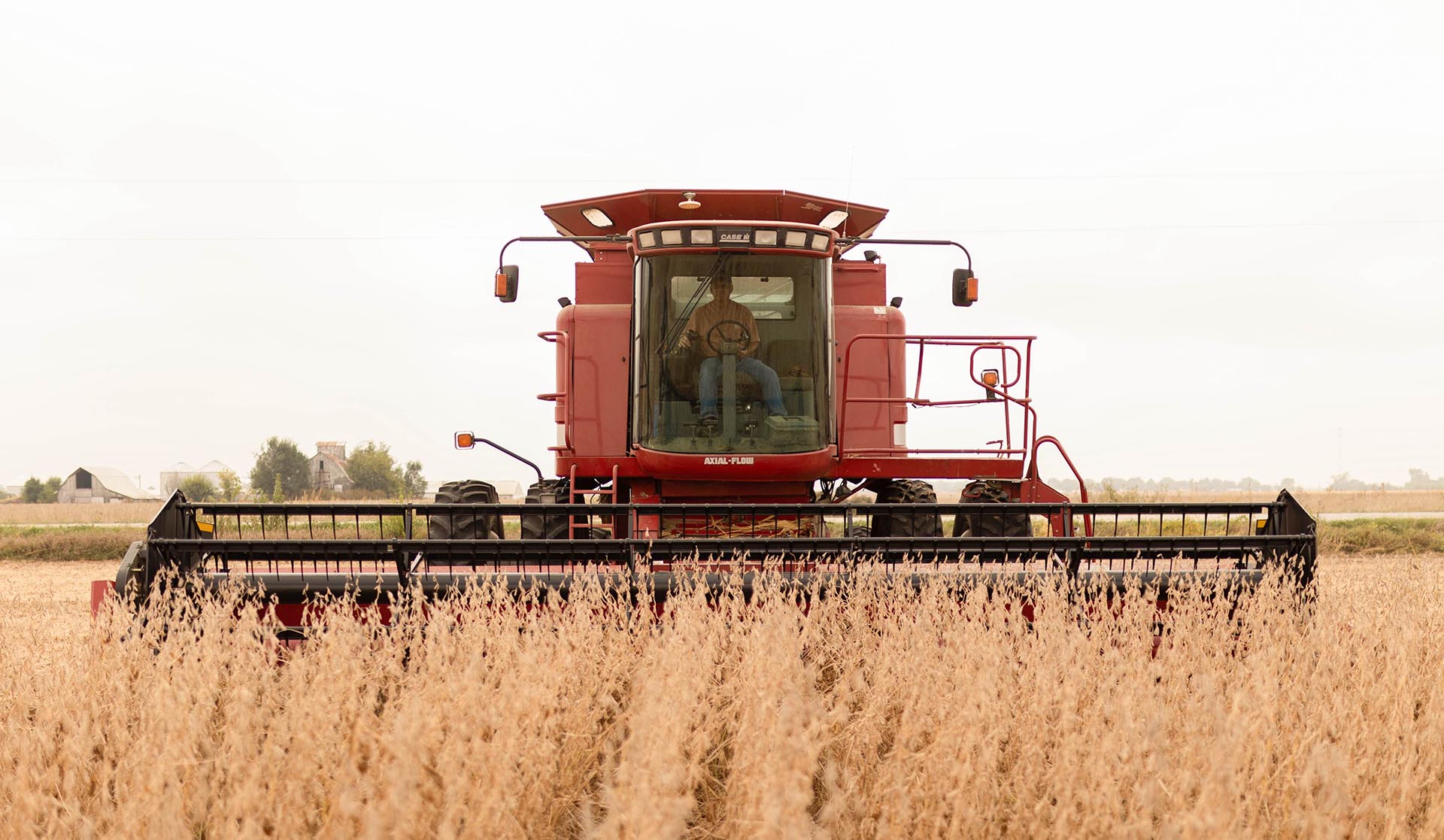 Red combine in field