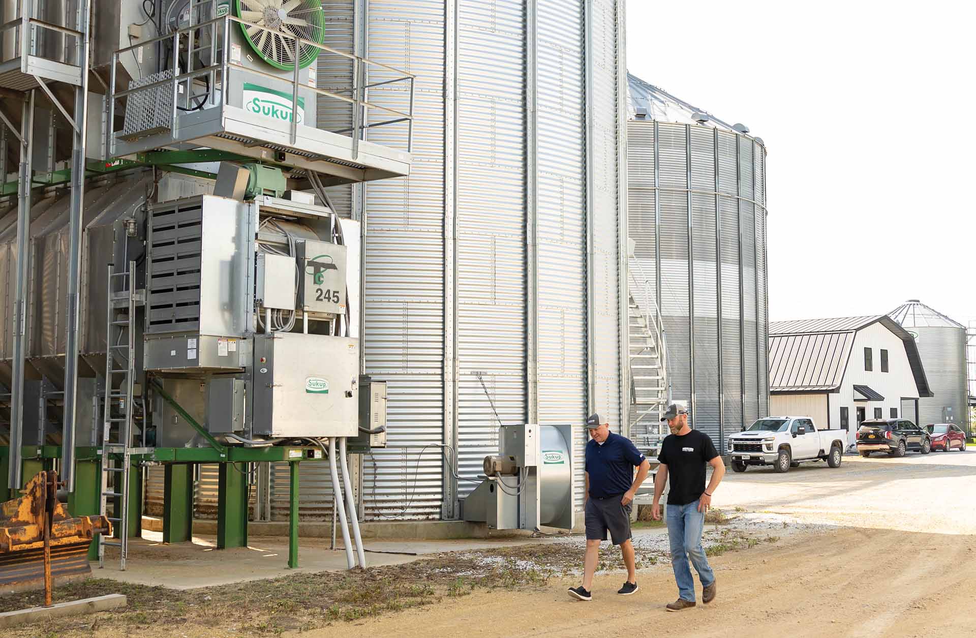 Ag professionals walking around bins