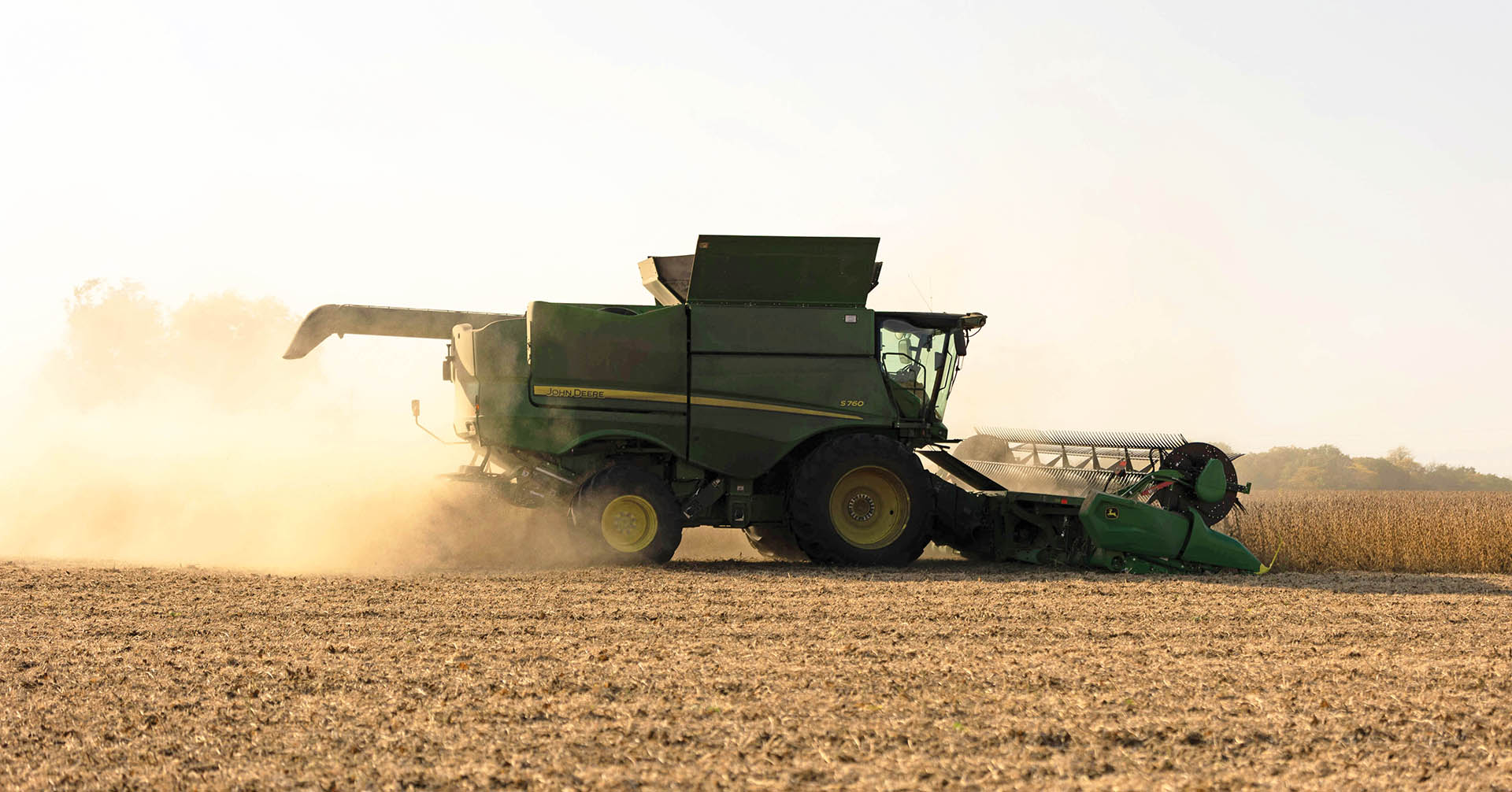 John Deere combine in soybean field