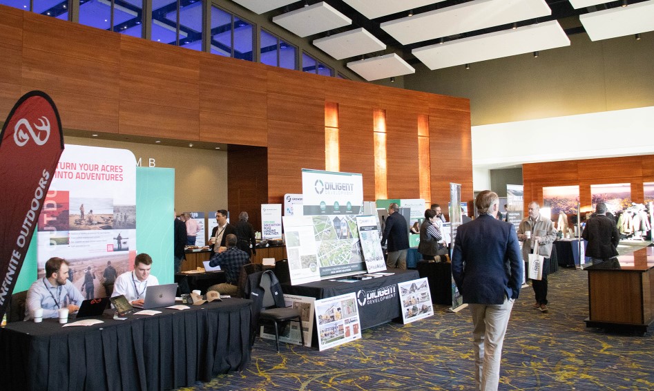 Vendors talking to people about land