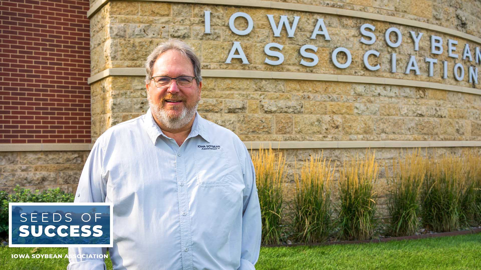 Roger Wolf in front of Iowa Soybean Association buildin