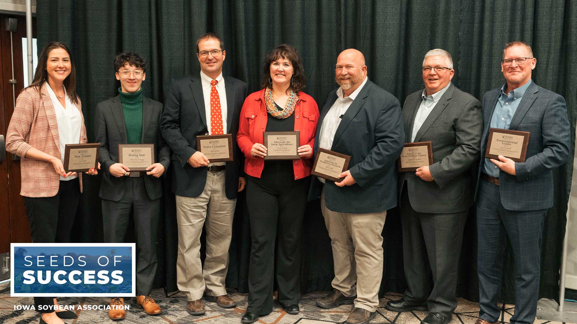 Seven leaders in agriculture posting with awards