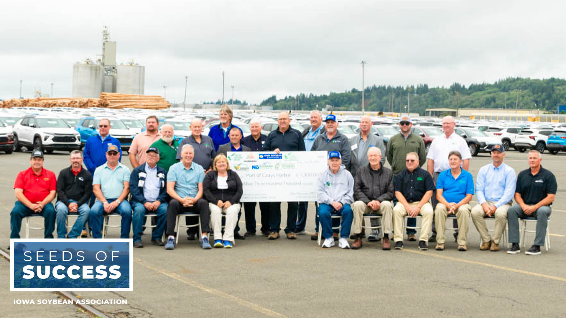 Soybean stakeholders with large check