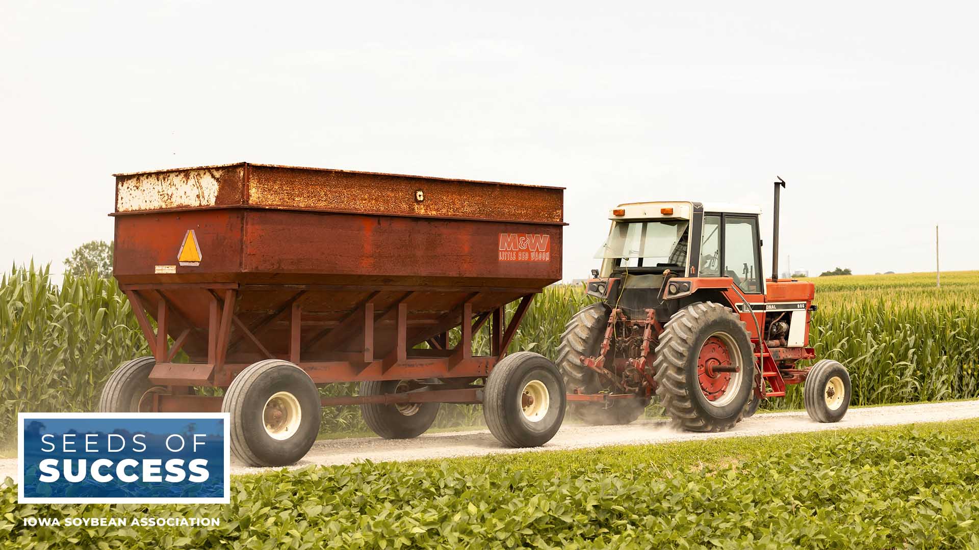 Red tractor pulling wagon