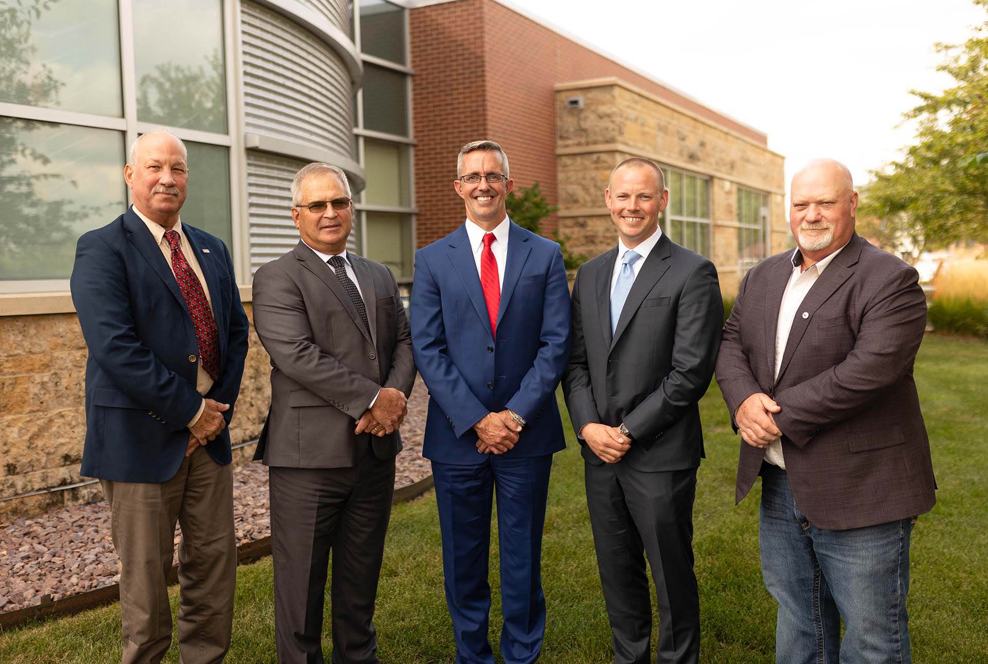 Committee poses in front of Iowa Soybean Association