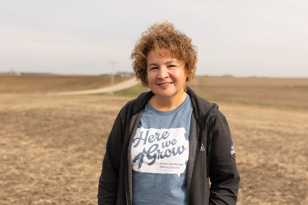 Iowa farmer stands in soybean field