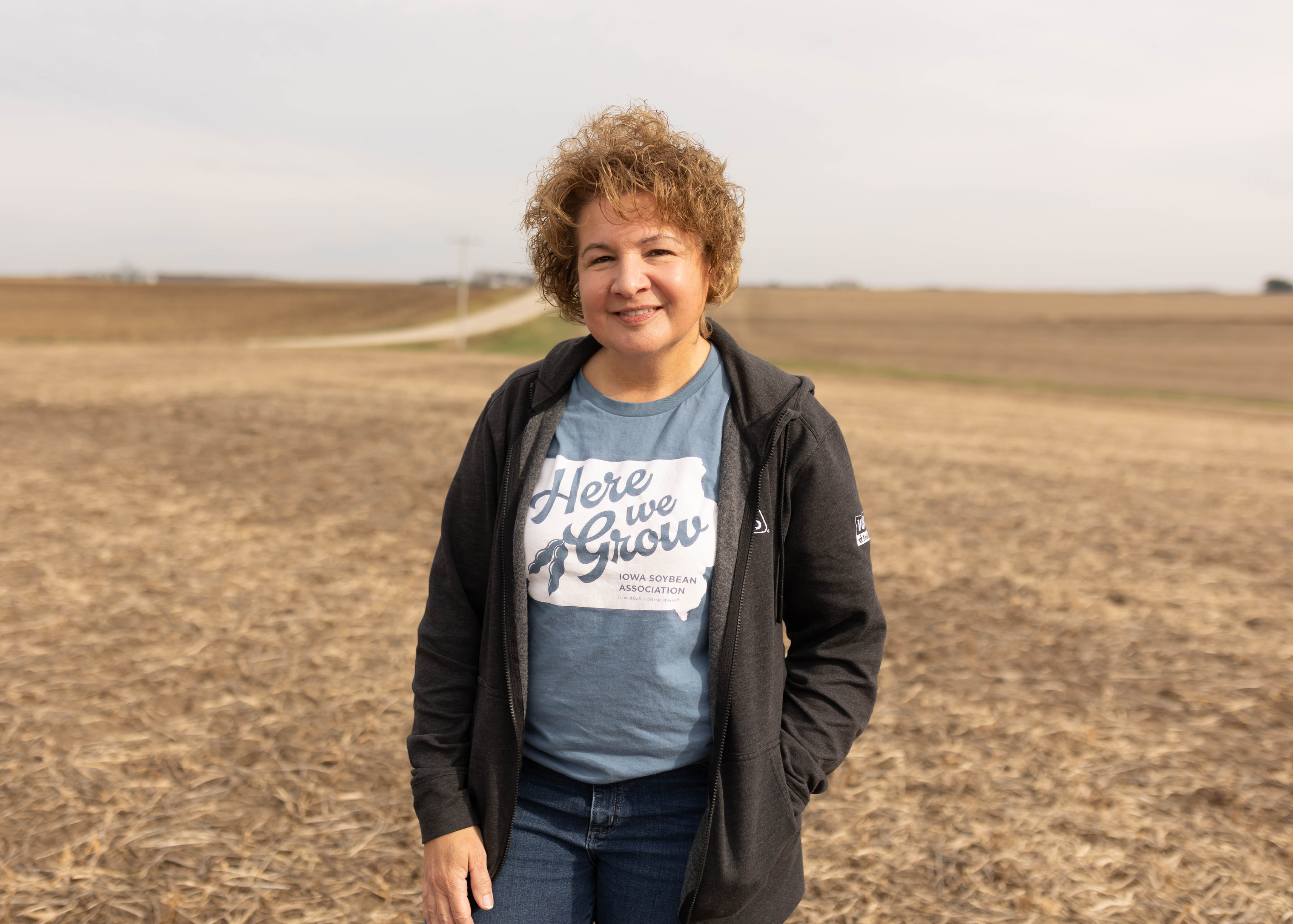 Iowa farmer stands in soybean field