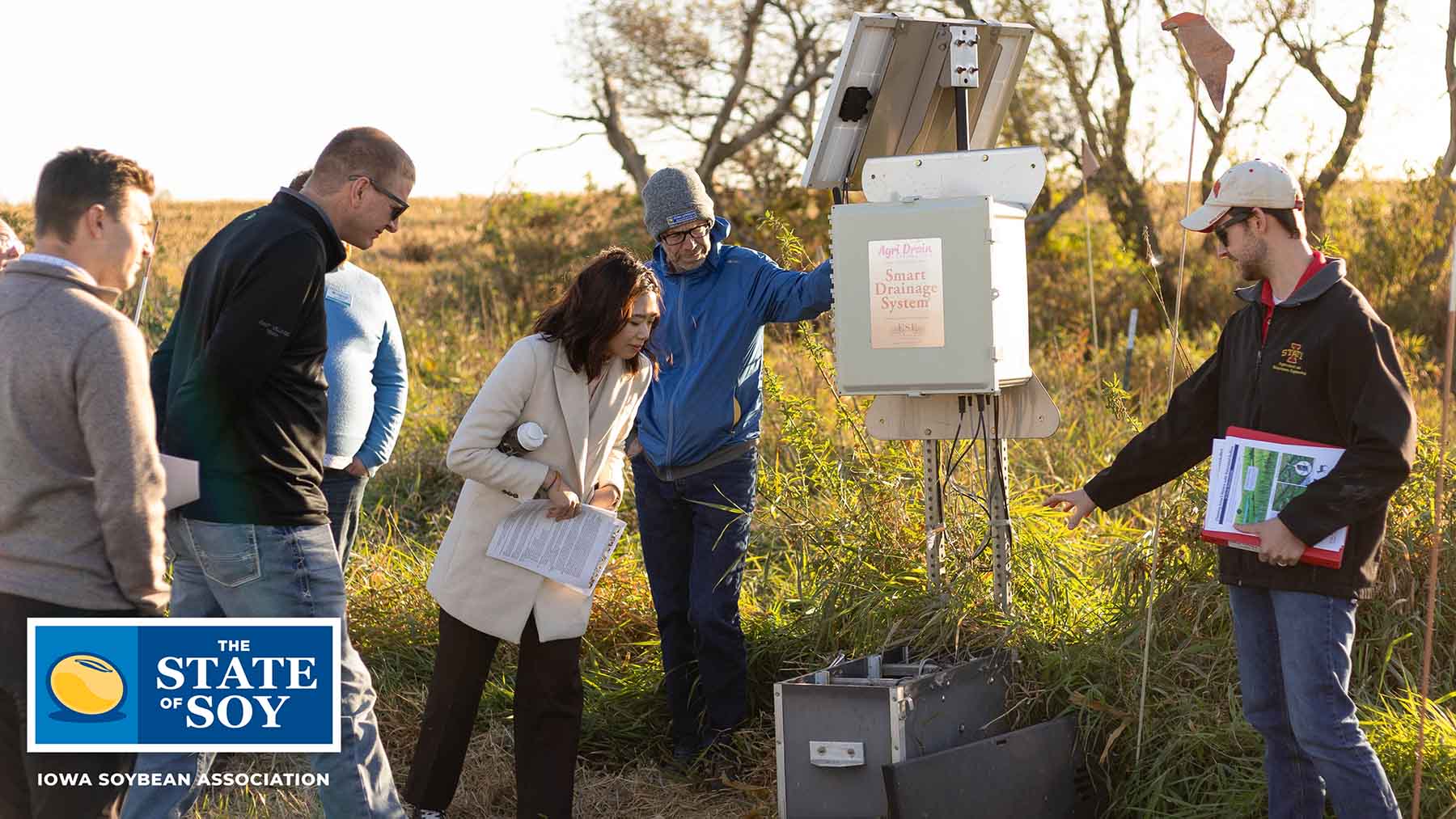 Community leaders inspecting water quality technology