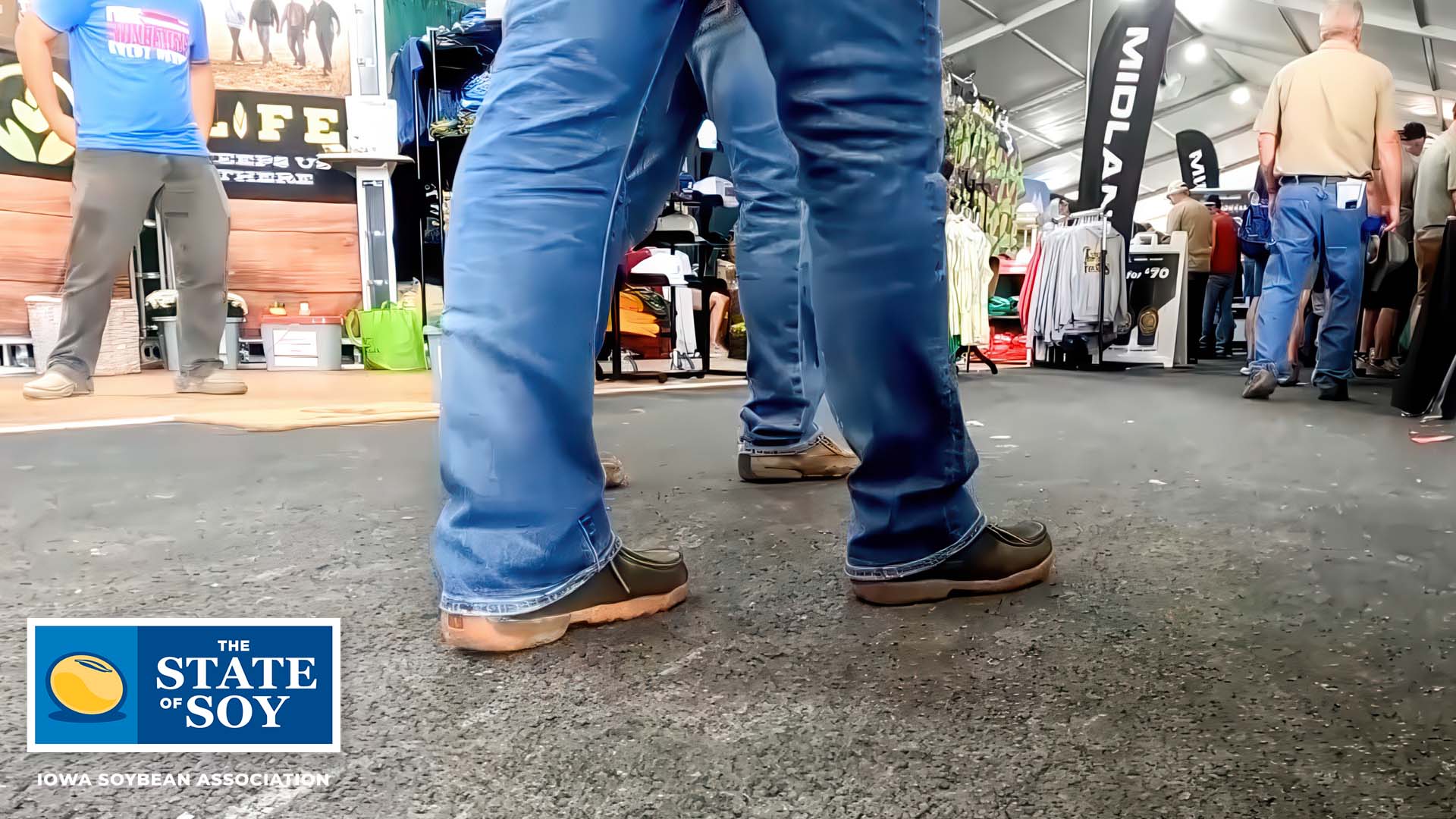 Man walking on soy asphalt at the Farm Progress Show