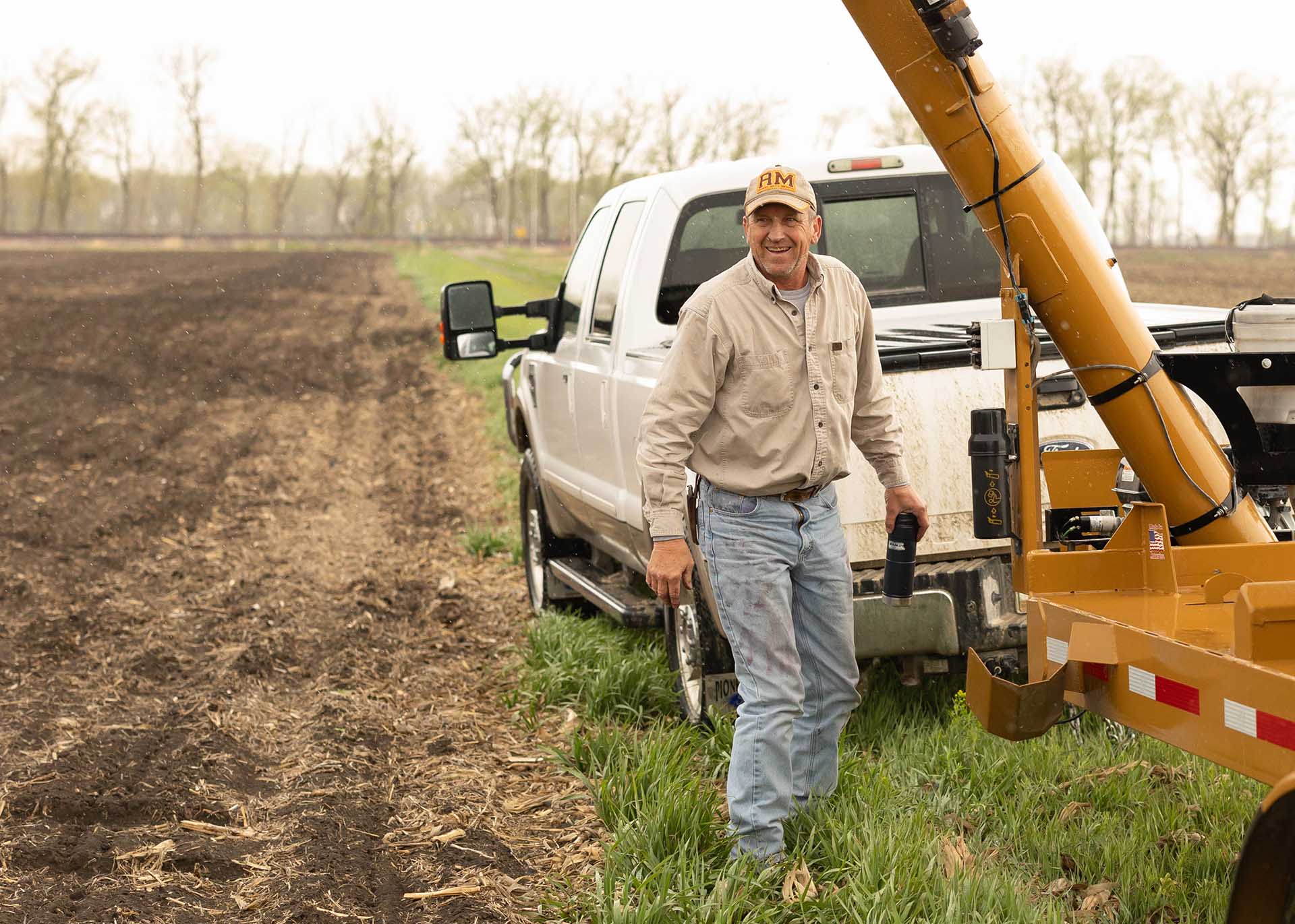 Farmer with truck in field